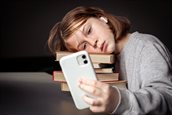 little-girl-sits-near-books-takes-selfie-bored-from-reading