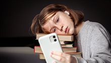 little-girl-sits-near-books-takes-selfie-bored-from-reading